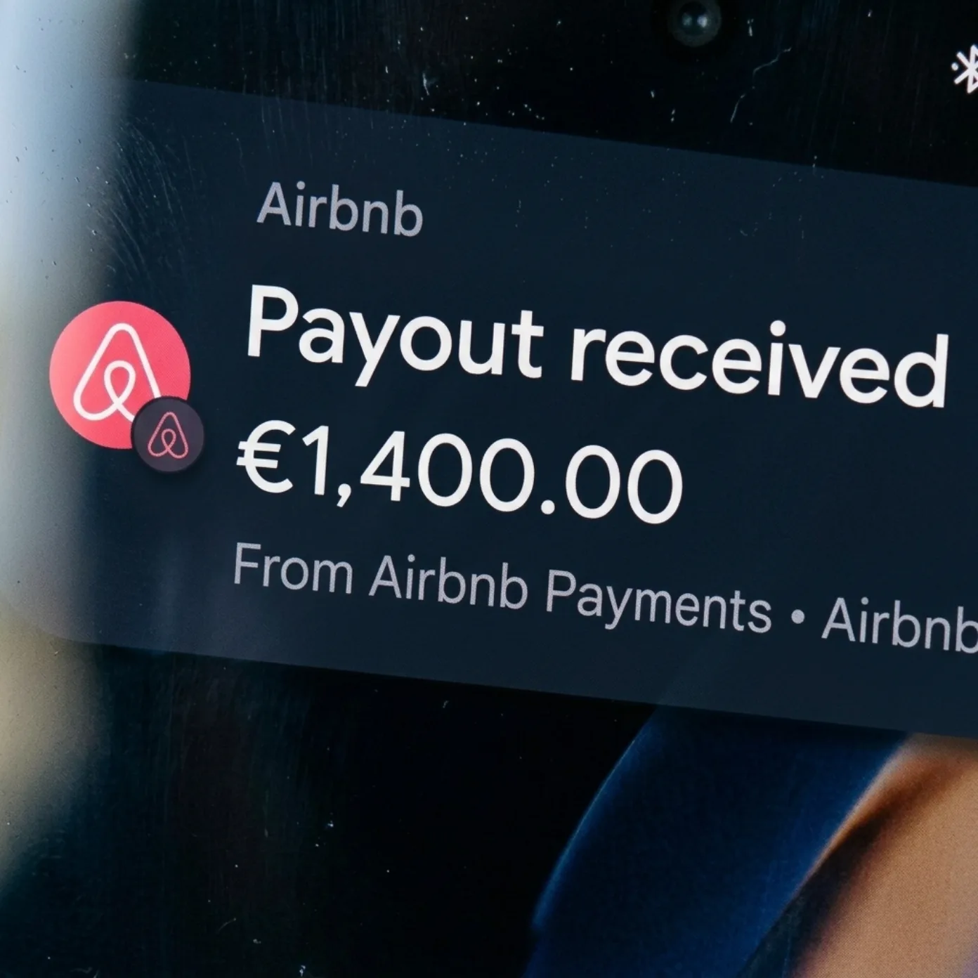An Airbnb payout notification on the owner's phone